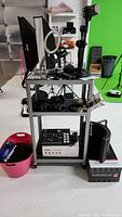 Front view of cart on casters with audio equipment