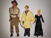 Front view of three figures: Indiana Jones, Dick Tracy, and Breathless Mahoney