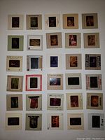 Grid layout of all 30 mounted slides with various brands visible and model images.