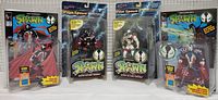 Front view of the four Spawn action figures in original packaging (Spawn, Medieval Spawn, Pilot Spawn Black, Pilot Spawn White).