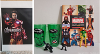 Iron Man Avengers poster, Incredible Hulk glasses, GI Joe miniatures, Phoenix figure and Marvel book laid on surface.