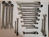 Full assortment of GEARWRENCH ratcheting wrenches showing multiple sizes and styles (flex head and static).