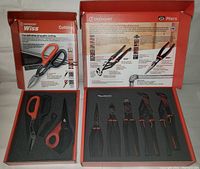 Front view of Wiss scissors and Crescent pliers in branded red boxes with foam inserts holding each tool.