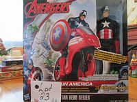Front view of boxed Marvel Avengers Captain America figure and red motorcycle vehicle