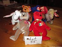 Front view of 6 Beanie Baby plush toys including 4 teddy bears and 2 dragons showing tags and color details