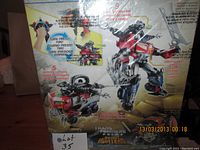 Back of the box showing detailed features of the toy, including spinning cannons, rapid fire missile function, and combined robot/beast modes.