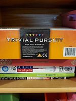 Trivial Pursuit board game box back view showing brand new sealed packaging and barcode