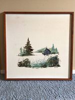 Full view of the framed Callebaut art print showing the entire piece with wooden frame and matting.