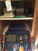 Bob Villa nylon tool bag with hand tools inside, front view.