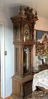 Full view of oak stained grandfather clock