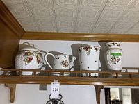 All four Royal Albert Old Country Roses china pieces displayed on shelf