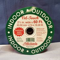 Spool label showing brand Vel-Touch, dimensions 2.5 in wide by 60 ft long, indoor/outdoor use, shapeable wired ribbon, made in USA with acrylic and polyethylene materials.