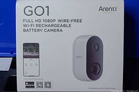 Box front showing Arenti GO1 branding, depiction of the camera, and mention of full HD 1080p wire-free, Wi-Fi, rechargeable battery features.