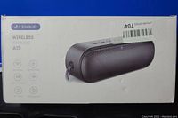 Photo of white box packaging showing the Lenrue wireless speaker A15 in black with image and product icons.