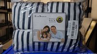 Front view of the blue and white striped bed sheet set in sealed packaging with Best Season label showing family image and money back guarantee.