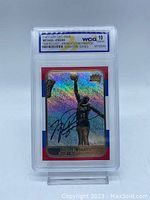 Front of the graded Michael Jordan card showing holographic prism finish and facsimile signature with WCG 10 GEM-MT label