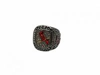 Angled view of 2011 St. Louis Cardinals inspired championship ring, showing red cardinal on bat and 'WORLD CHAMPIONS' wording around face with sparkling stones.