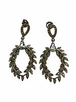 Front view of both earrings showing the pear aquamarine and surrounding sapphire diamond cut stones in a leaf pattern on sterling silver.