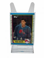 Front of 1989 O-Pee-Chee Joe Sakic Rookie Card showing Joe Sakic in Quebec Nordiques jersey with Topps logo and card number 113.