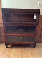 Front view of three stacked oak sections and removable top cap