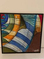 Front view of a square contemporary abstract painting by an Iranian artist with various geometric shapes and colors in a black frame.