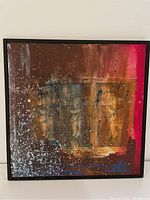 Front view of the abstract painting showing the color palette, text elements, and signature.