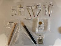 Photo showing multiple Gesswein jewelry making tools including gravers, milgrain wheel, burnisher, pin vise still in original packaging.