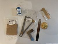 Full overview of all jewelry making tools included in the lot, showing the calipers, ruler, degree gauge, felt pads, Lube-Stik, and smaller tools.