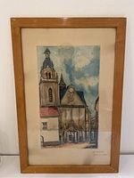 Full view of the framed lithograph showing the church scene with bell tower, clock, and surrounding buildings.