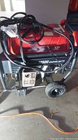 Left side view showing overall generator, frame, wheels and handle
