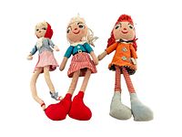 Photo showing all three rag dolls standing upright: two taller dolls on each side and smaller doll in middle, colors and sizes visible