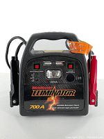 Front view showing brand, model, controls, light, and clamps attached on sides.