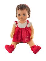 Full seated view of vintage 1962 Canadian Chatty Cathy Chatty Baby doll wearing original red outfit and shoes.