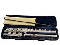 Vintage Etude silver flute shown disassembled in original hard case with dark blue plush interior, cleaning rod accessory visible.