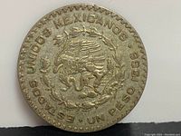 Obverse side showing Mexican national emblem with eagle and snake, inscriptions "ESTADOS UNIDOS MEXICANOS" and "UN PESO 1966 .720" focus on purity and date.