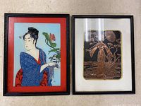 Photo of two framed Asian wall art pieces side by side - one colorful print and one metallic engraved art.