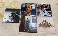 Photo showing five vinyl record albums including Billy Joel, Earth Wind & Fire, Kim Carnes, and Elton John.