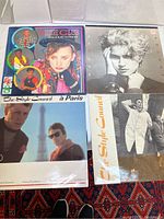Four vinyl album covers laid out on a carpet, including ones by The Style Council, Culture Club, and Madonna.