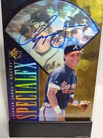 Front of the signed 1996 Upper Deck SP Special FX baseball card with Chipper Jones in Braves jersey and autograph in blue ink