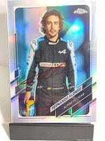 Full view of the 2022 Topps Chrome trading card featuring Fernando Alonso in Alpine F1 Team racing suit, signed by Alonso in red ink.