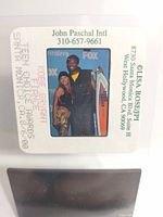 Camera slide showing Kobe Bryant and Vanessa at the Teen Choice Awards 2000 event, slide mounted in white frame with John Paschal Intl studio contact info and event details printed on it.