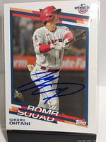 Front of signed Shohei Ohtani baseball card showing player batting action and autograph.