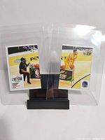 Front of two Panini mini basketball sticker cards showing Stephen Curry in action.