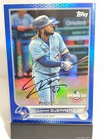 Front of 2022 Topps Blue foil Vladimir Guerrero Jr. signed baseball card showing image of player in Toronto Blue Jays uniform with signature.