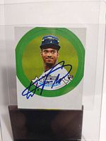 Front view of the small square baseball card with a green background circle featuring Wander Franco's image and autograph in blue ink.