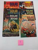 Six Silver Age Doctor Solar Man of the Atom comic books arranged with covers visible, showing various iconic cover art and issue numbers.
