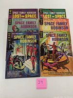 Six Space Family Robinson comic books laid out in two rows, showing front covers with various sci-fi themed illustrations.