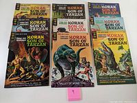 Lot of 9 Korak Son of Tarzan comic books arranged in three rows showing cover art and titles.