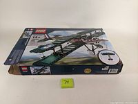 Box front showing Lego logo, Sopwith Camel model image, kit number 10226 and 883 pieces count, designed for ages 14+. Box is open, corners show some wear.
