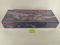 Top view of the boxed sealed model kit featuring artwork of the Catalina PBY-5a on the cover with detailed text.